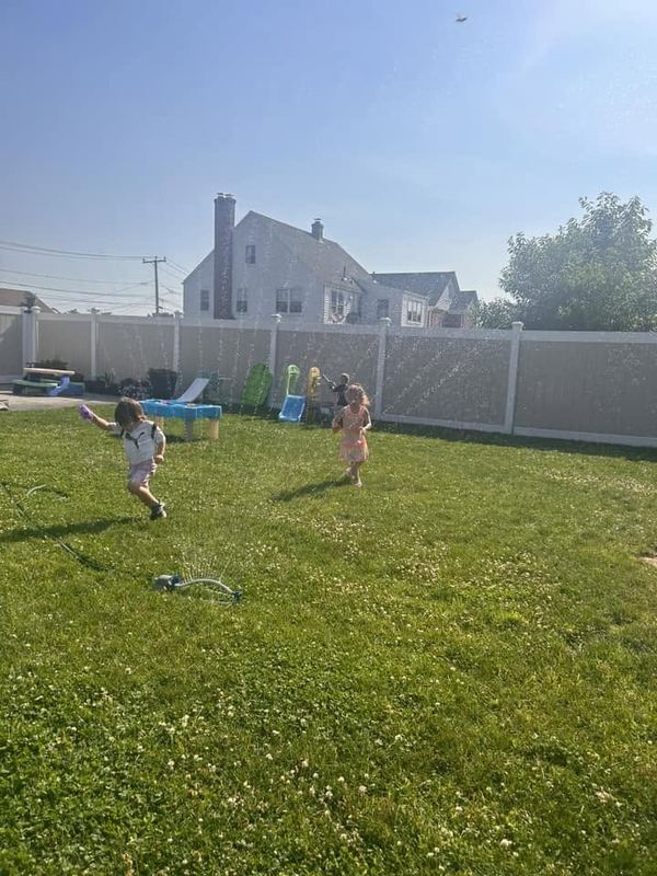 Children running in the big backyard