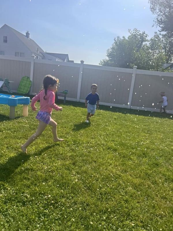 A girl running across the lawn